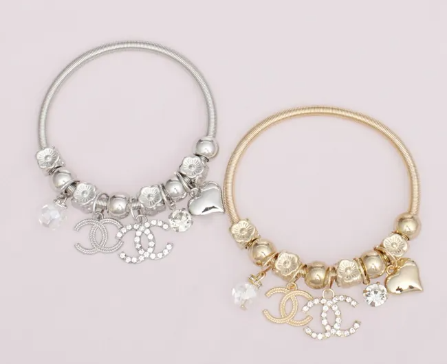 1000-18 - Double CC Charm Jump Coil Bracelets INSPIRED