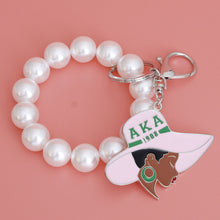 Load image into Gallery viewer, AKA Pink Green Hat Pearl Keychain
