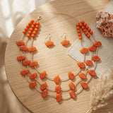 Layered Orange Disc and Gold Tube Bead Necklace