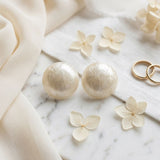 Ivory Pearlescent Domed Round Stud Earrings