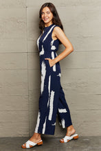 Load image into Gallery viewer, Printed Round Neck Cutout Jumpsuit with Pockets
