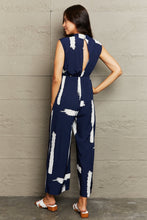 Load image into Gallery viewer, Printed Round Neck Cutout Jumpsuit with Pockets
